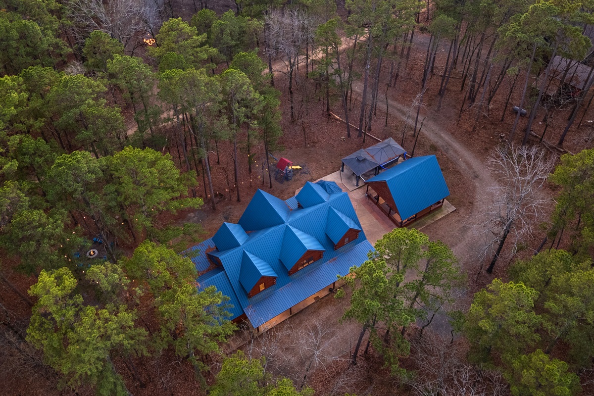 From above, Blue Bass Lodge sits peacefully among the trees, offering space, comfort, and a true Broken Bow escape.