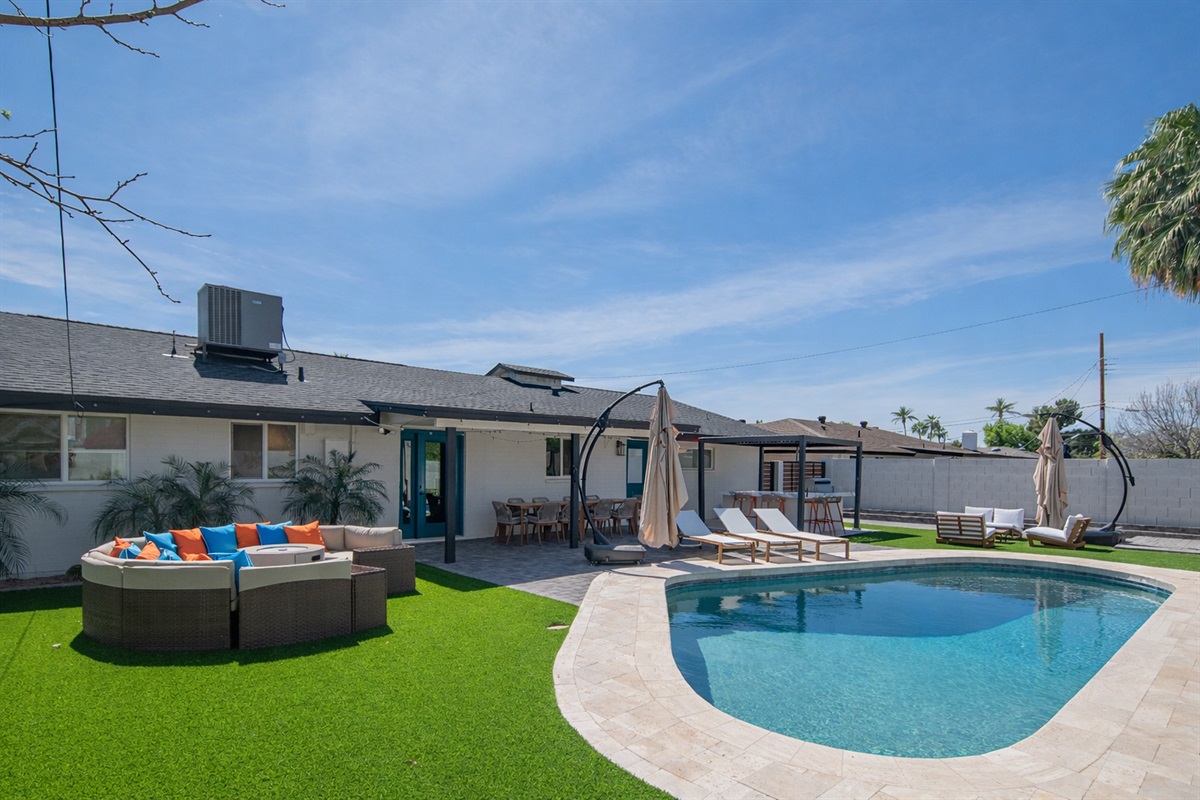 Private backyard oasis with FREE heater pool, lounge seating, and outdoor dining area, fire pit lounge