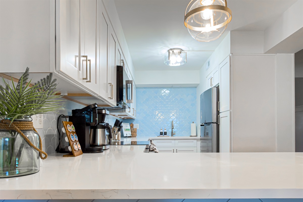 The kitchen island opens directly into the living and dining areas, making it easy to chat with your group while prepping snacks.