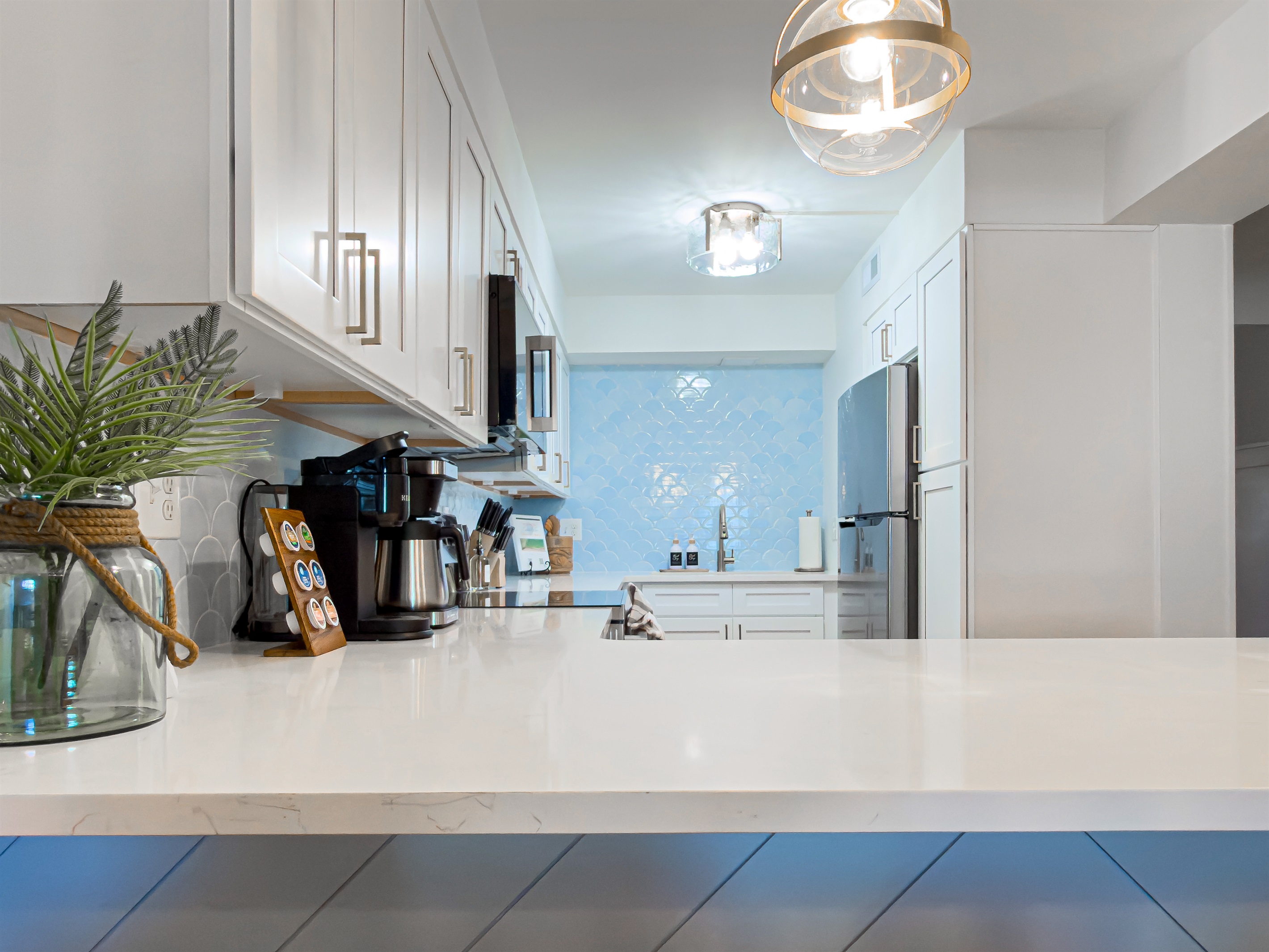 The kitchen island opens directly into the living and dining areas, making it easy to chat with your group while prepping snacks.