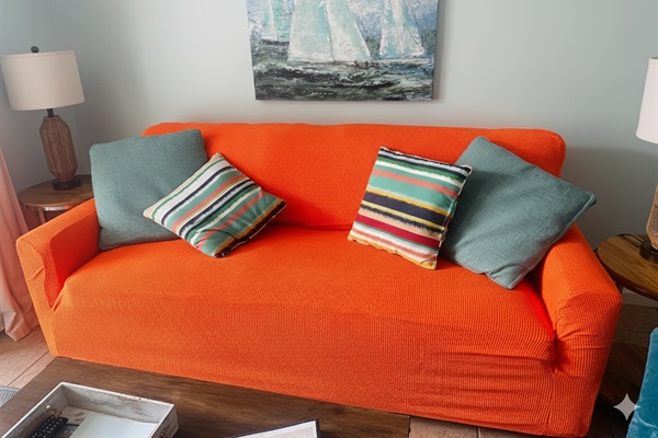 A Fresh Update: We’ve recently added this textured orange cover to our living room sofa. While we wait for our new professional photos, we wanted you to see exactly how the space looks today—bright, clean, and ready for your stay.