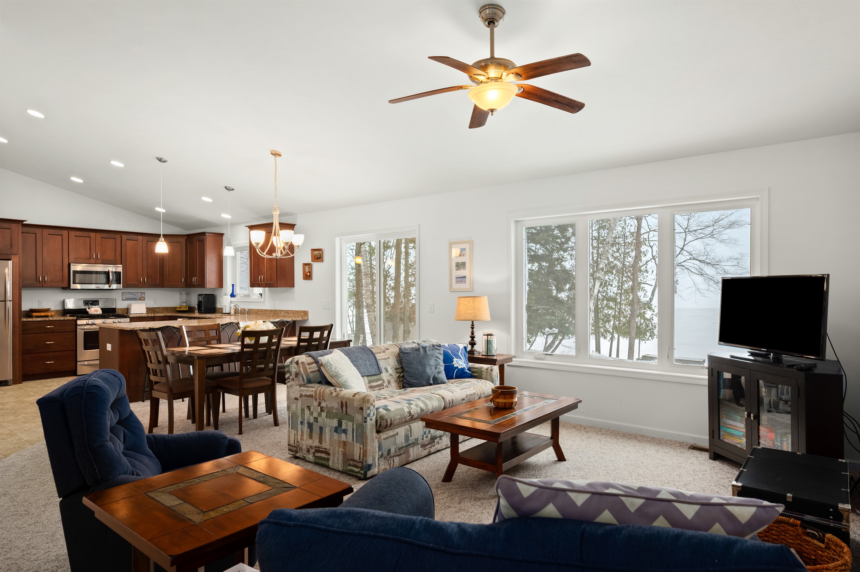 Open-concept living room with lake views and cozy seating