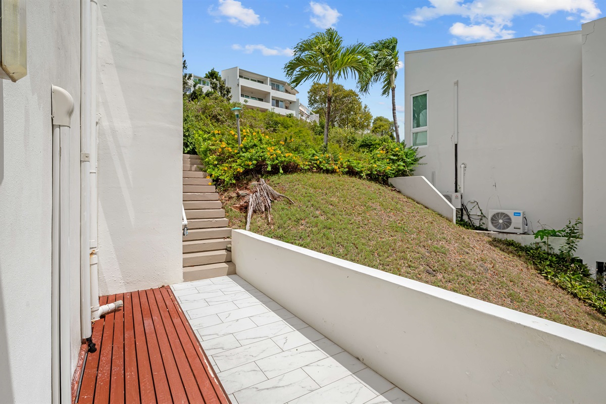 Down a flight of stairs from the parking area to your condo