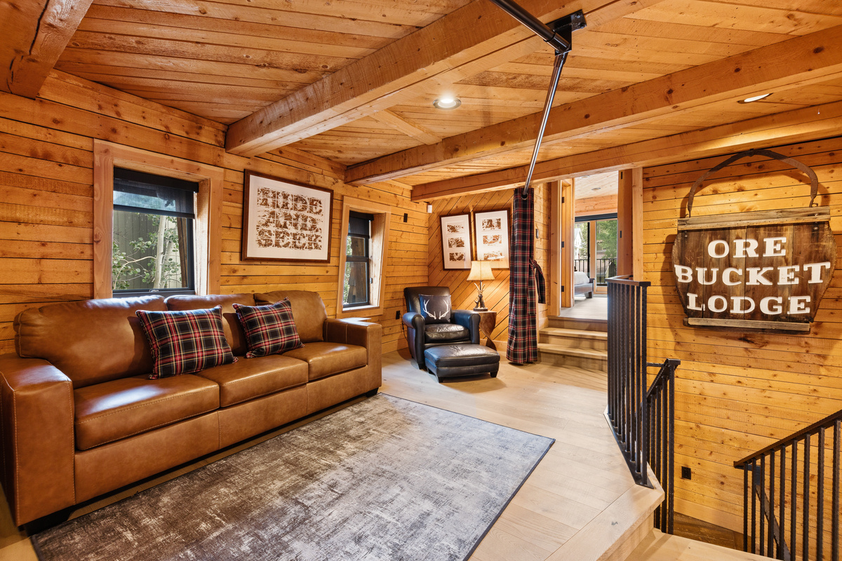 Upper level loft / multi-function living space with Queen sleeper sofa and a privacy partition curtain