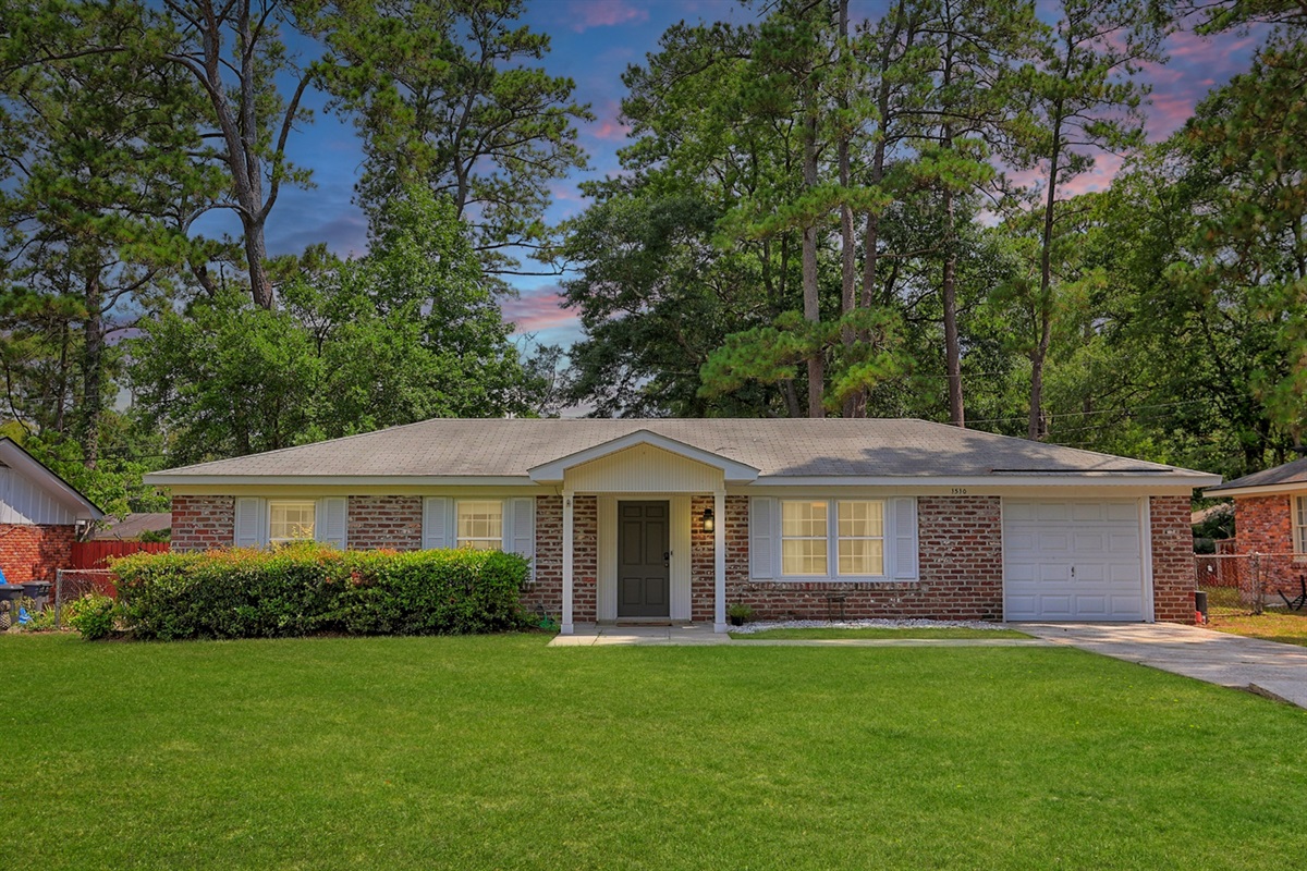 Welcome to Buckingham Breeze—classic brick charm with a lush green yard to match.