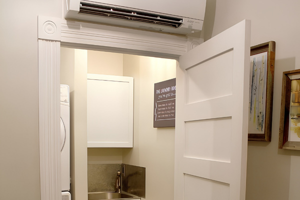 The lower level of the farm house includes a complete laundry with stacked washer and dryer, wash sink, folding area and laundry baskets for each guest
