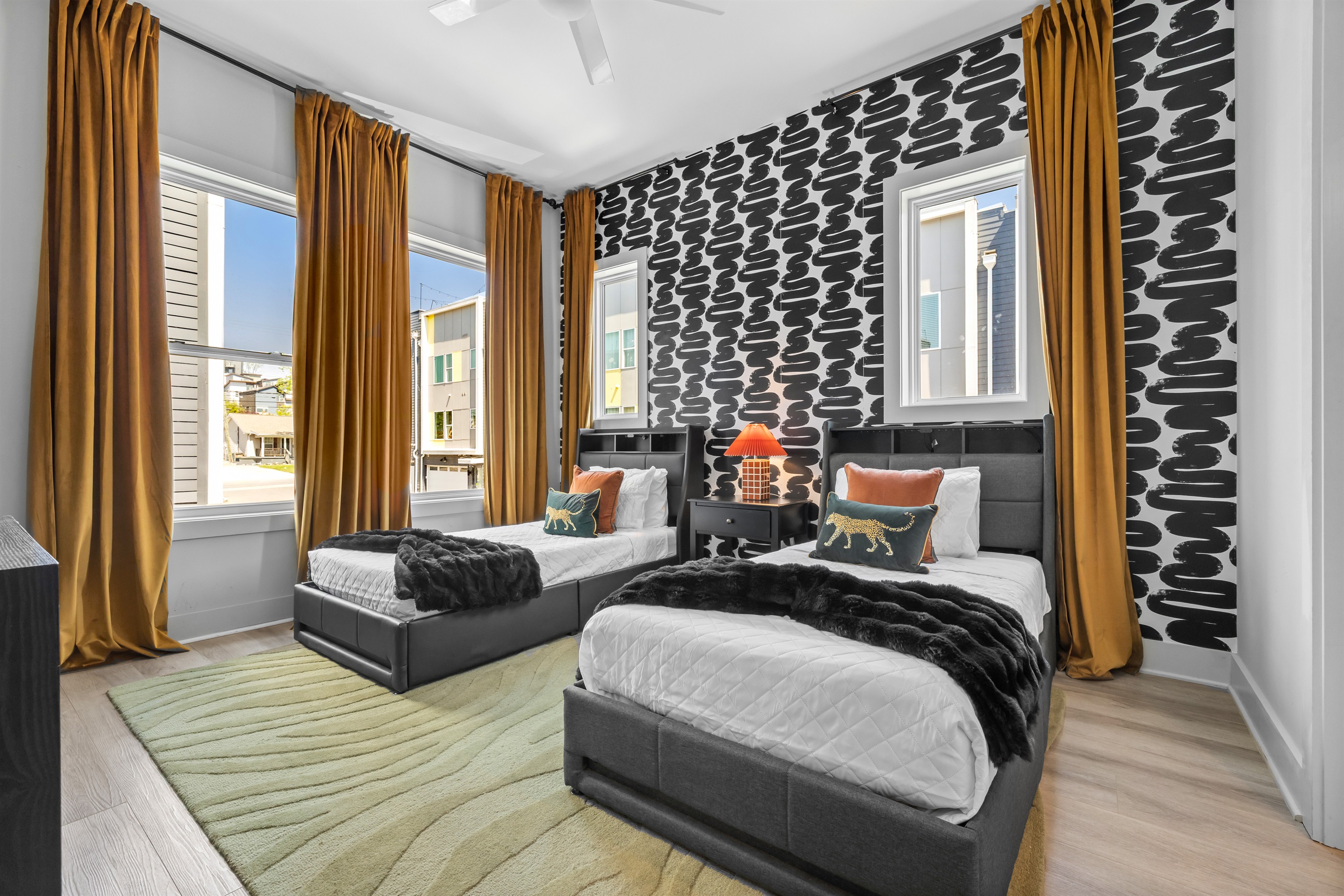 Charming Twin Room: Vibrant decor and sunshine-filled windows create a playful retreat!