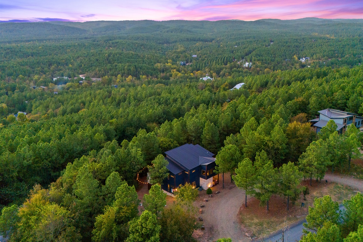 Surrounded by the lush beauty of the mountains, this aerial view highlights just how special this hidden cabin is.