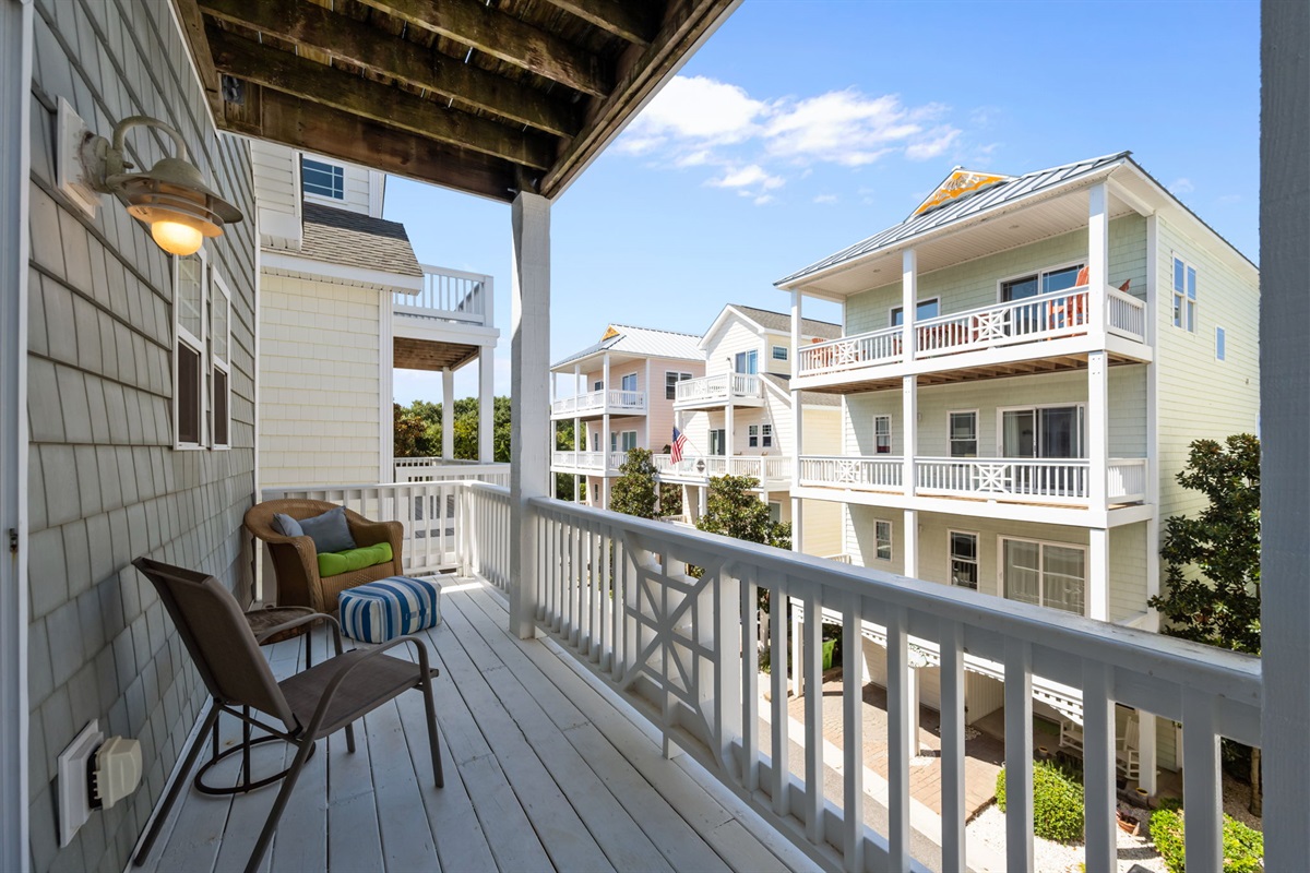Imagine sipping your morning coffee on this cozy balcony!