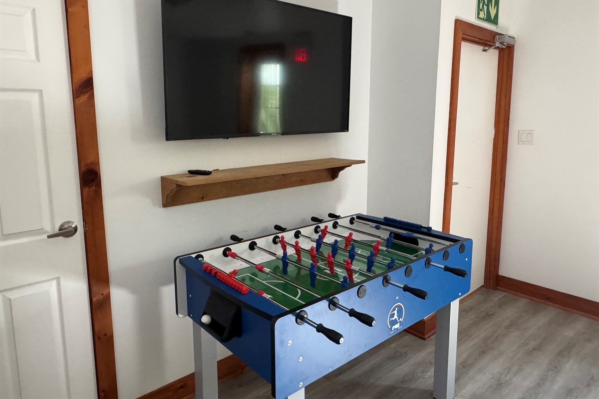 Game room with foosball Table & TV
