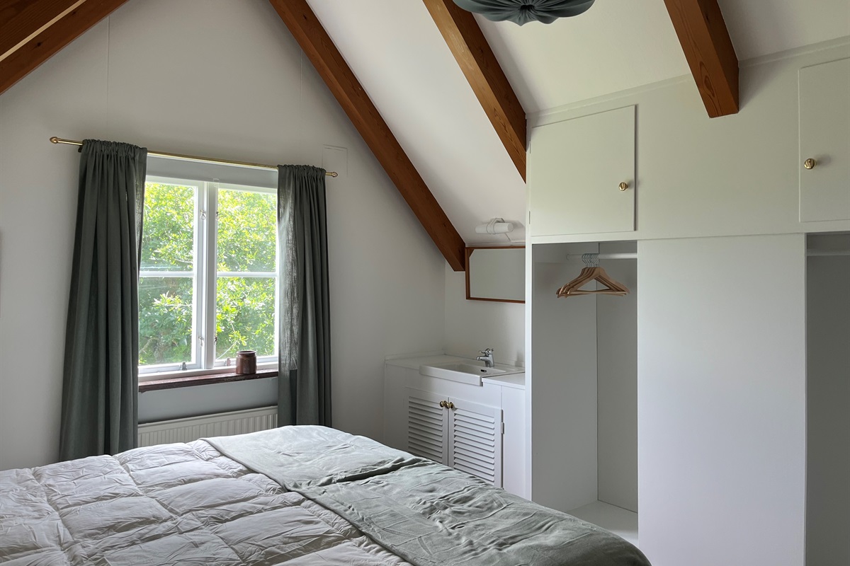 Bedroom 2: wardrobe and storage. Both bedrooms are on separate floors for added privacy