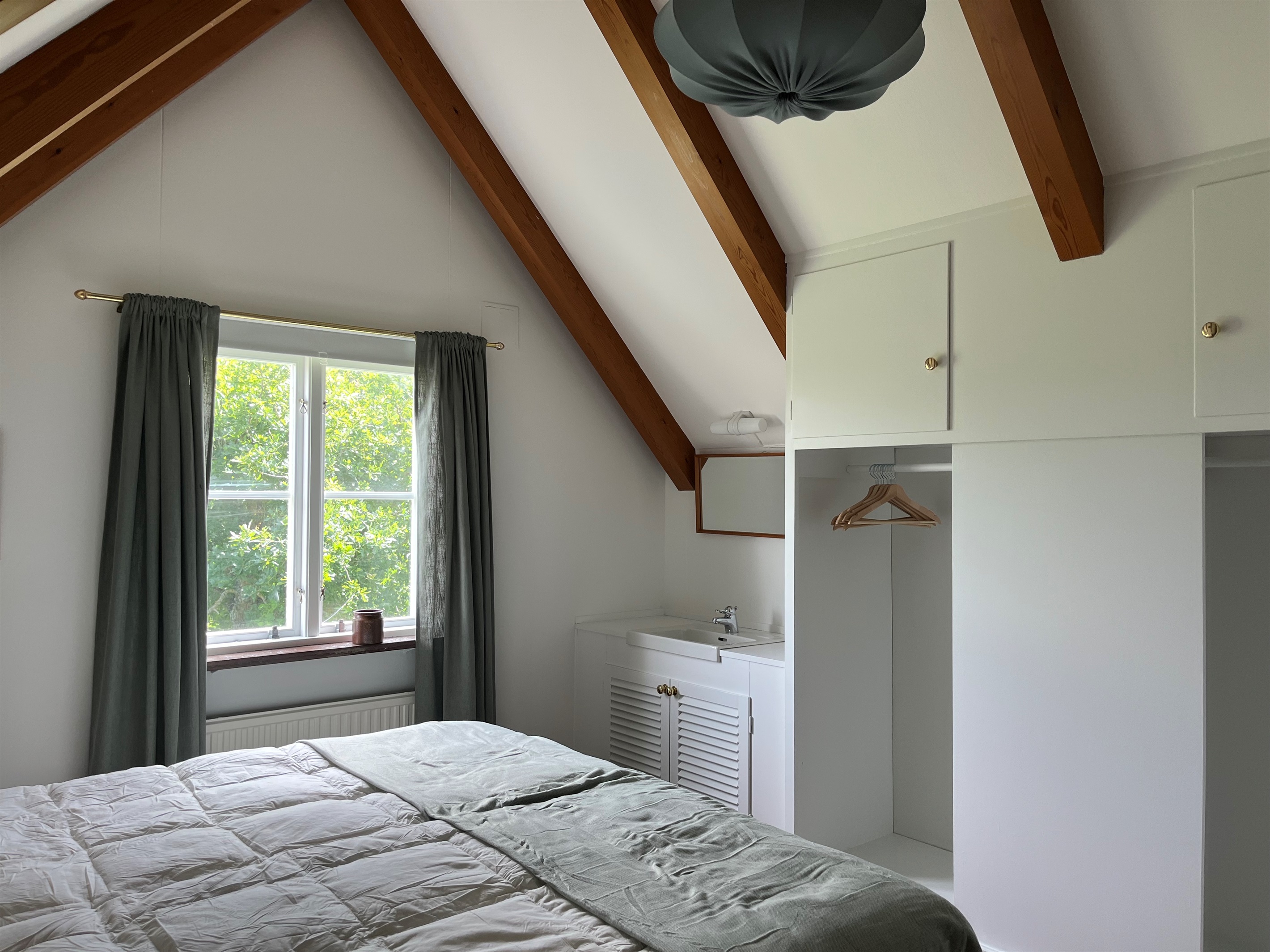 Bedroom 2: wardrobe and storage. Both bedrooms are on separate floors for added privacy