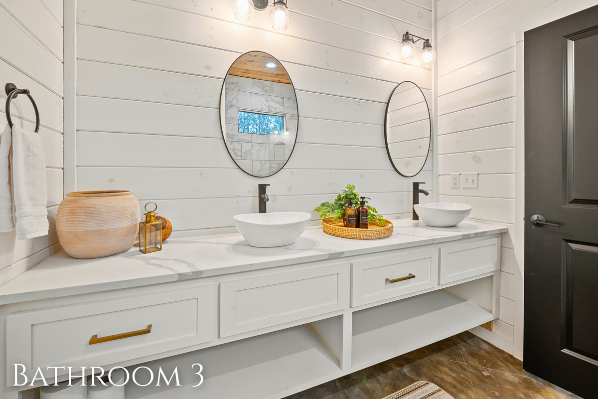 Elegant simplicity meets function in this bright bathroom. Get ready for your day in this tranquil space.