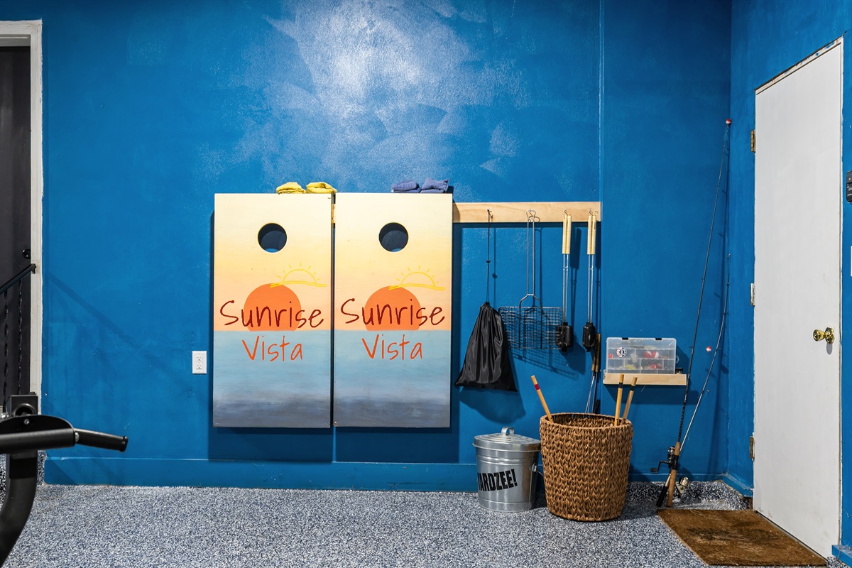 Guests can enjoy a game of cornhole along with other fun yard games, perfect for friendly competition outdoors