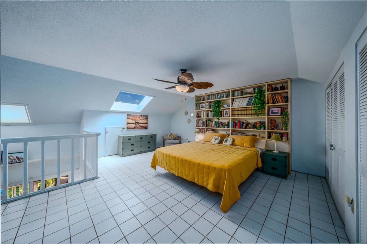 Cozy loft bedroom offering a unique and relaxing retreat above the main living area.