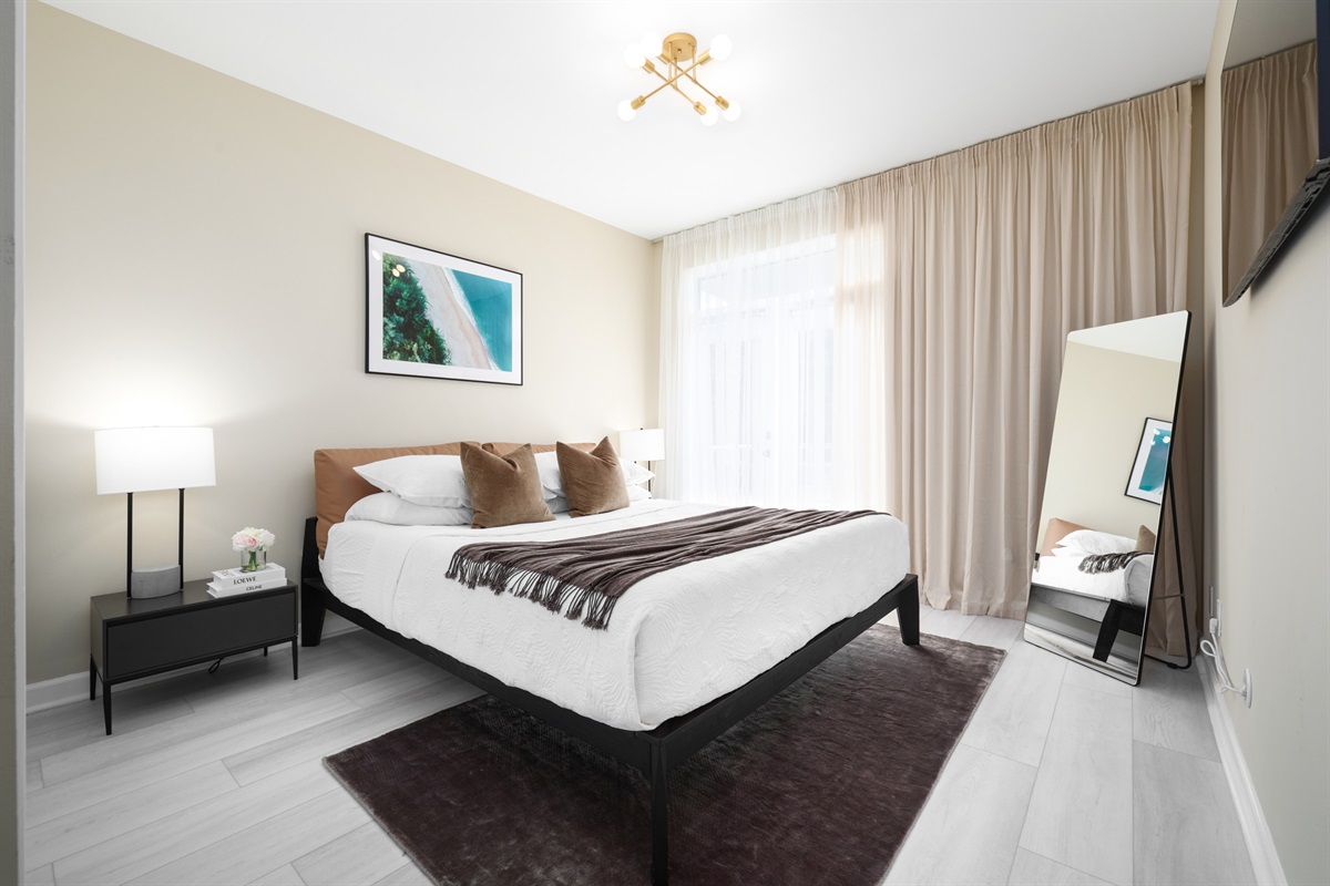 Bedroom 2 (1st Floor): KING bed, Patio Access, Smart TV, Bathroom with Remodeled Walk-in Shower in Hallway - shared with Bedroom 2 (Sleeps 2)