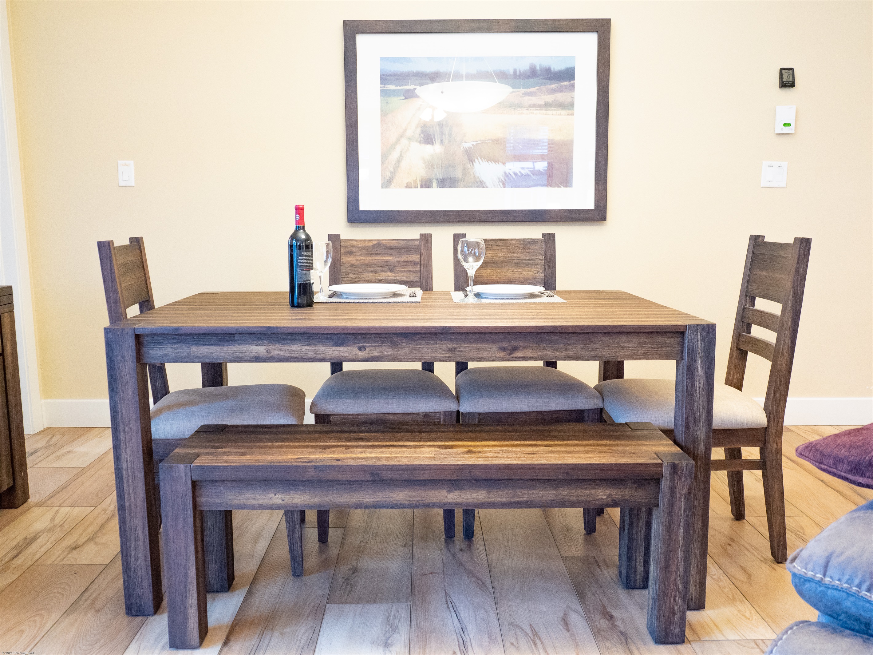 dining table has 4 chairs and a bench