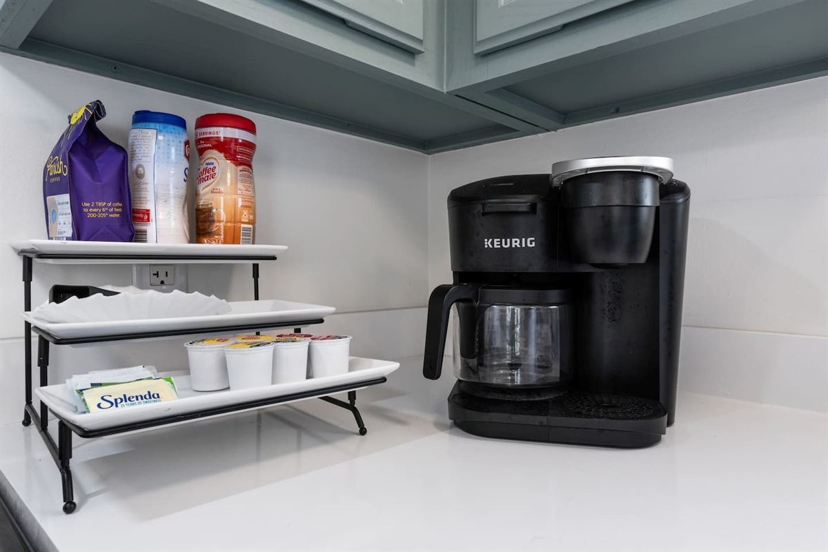 Keurig K-Duo with pods, creamer, and sweetener. 