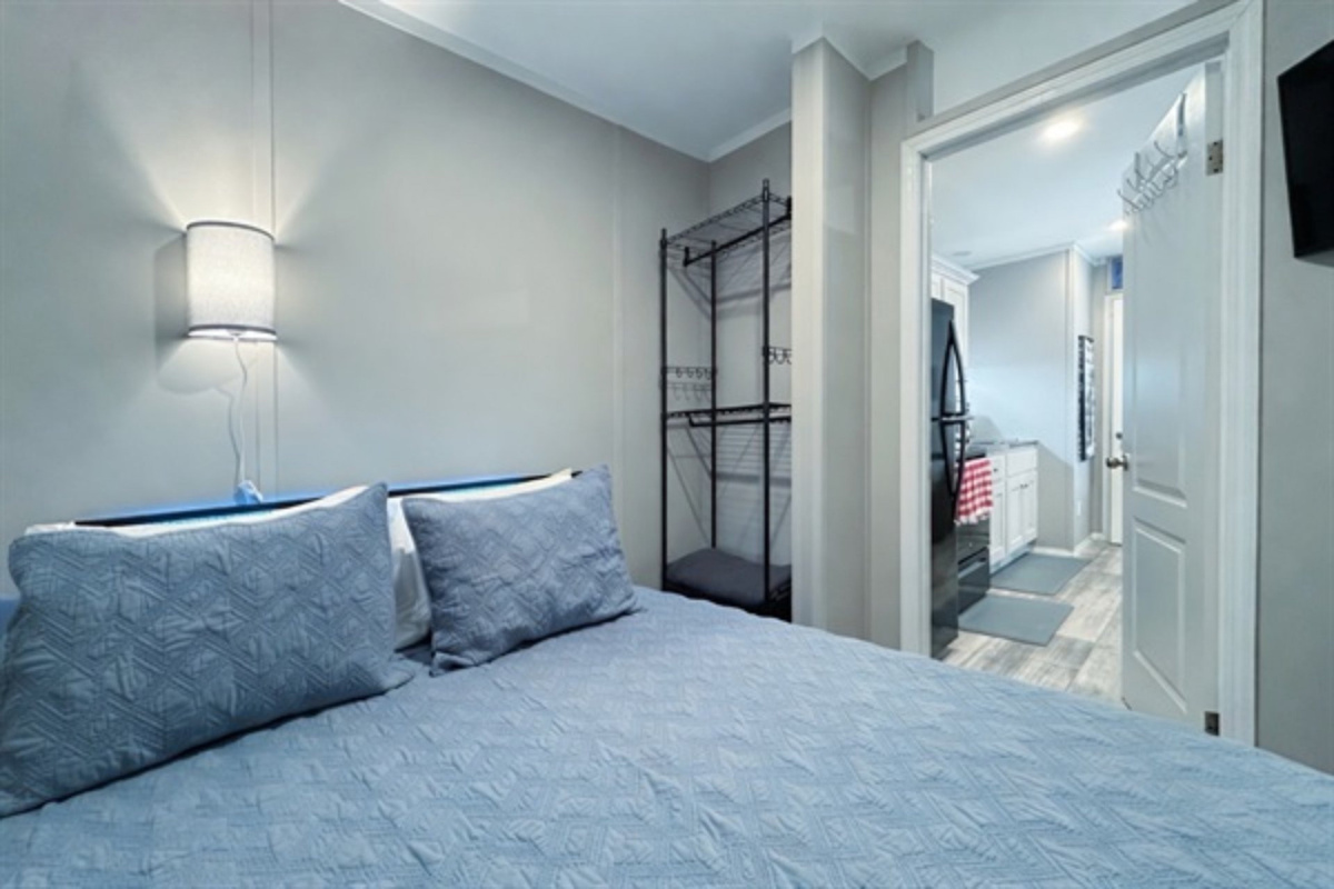Bedroom #2 with queen bed, smart TV and en suite bathroom