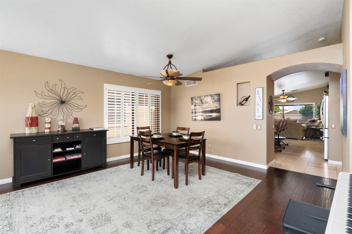 A dedicated dining space with room to spread out, paired with a stylish sideboard stocked with games — great for post-dinner Monopoly nights with the family.