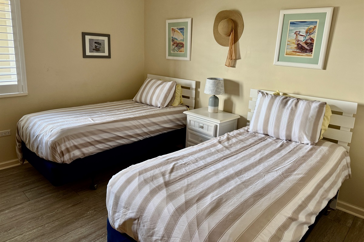Guest Room w/Two Twin Beds, TV, and En Suite Bath