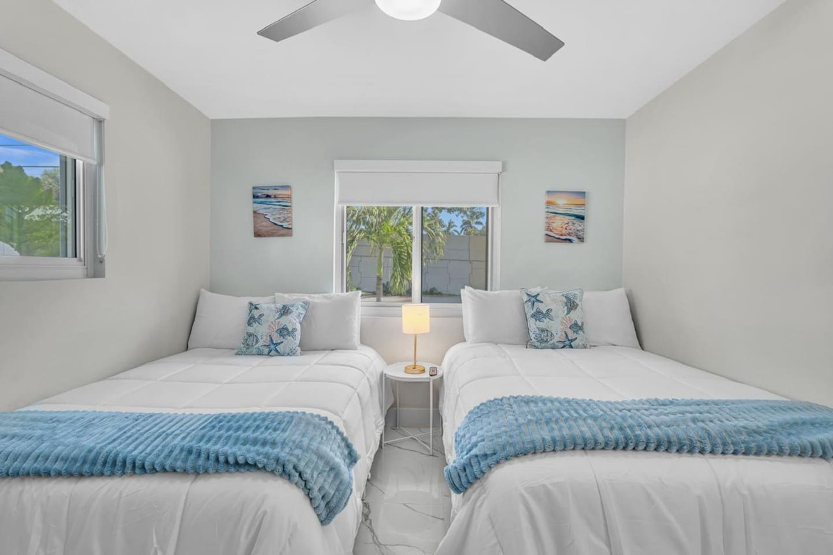 Cozy bedroom with two full-size beds, perfect for family and friends.
