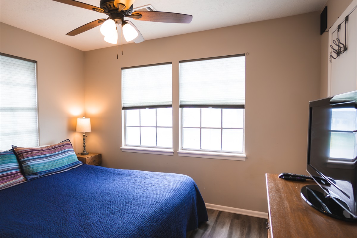 bedroom with king bed and smart TV