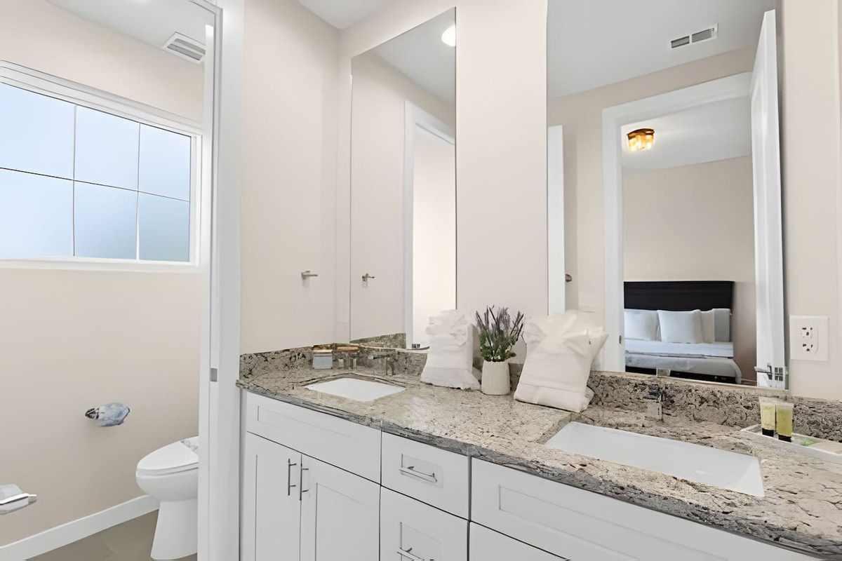 Bright and spacious bathroom with a clean, modern design.
