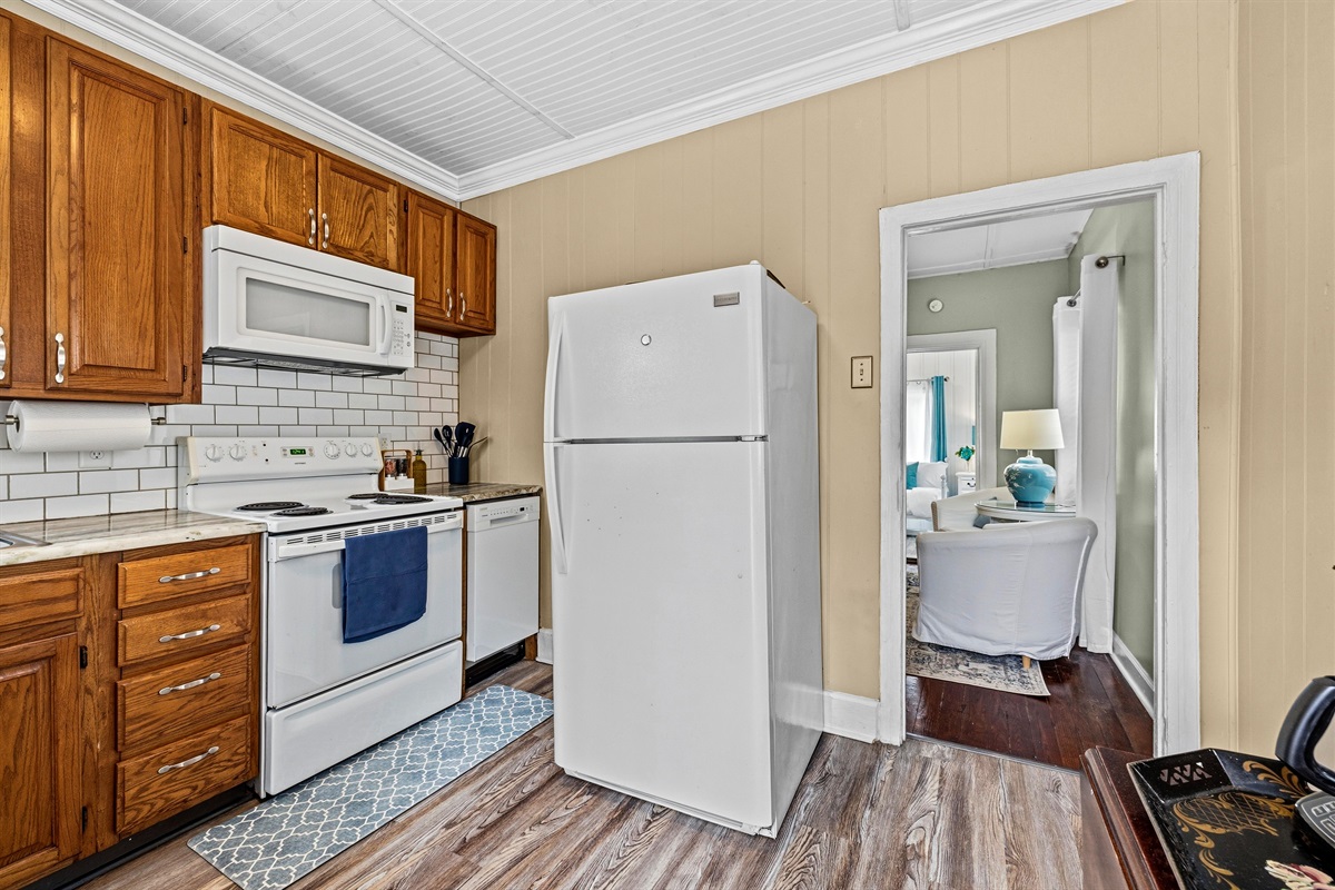 Kitchen with granite countertops and tile backsplash.