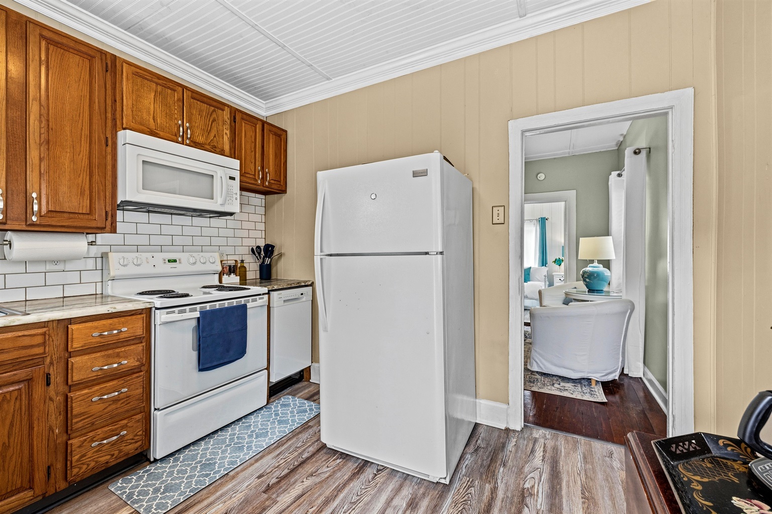 Kitchen with granite countertops and tile backsplash.