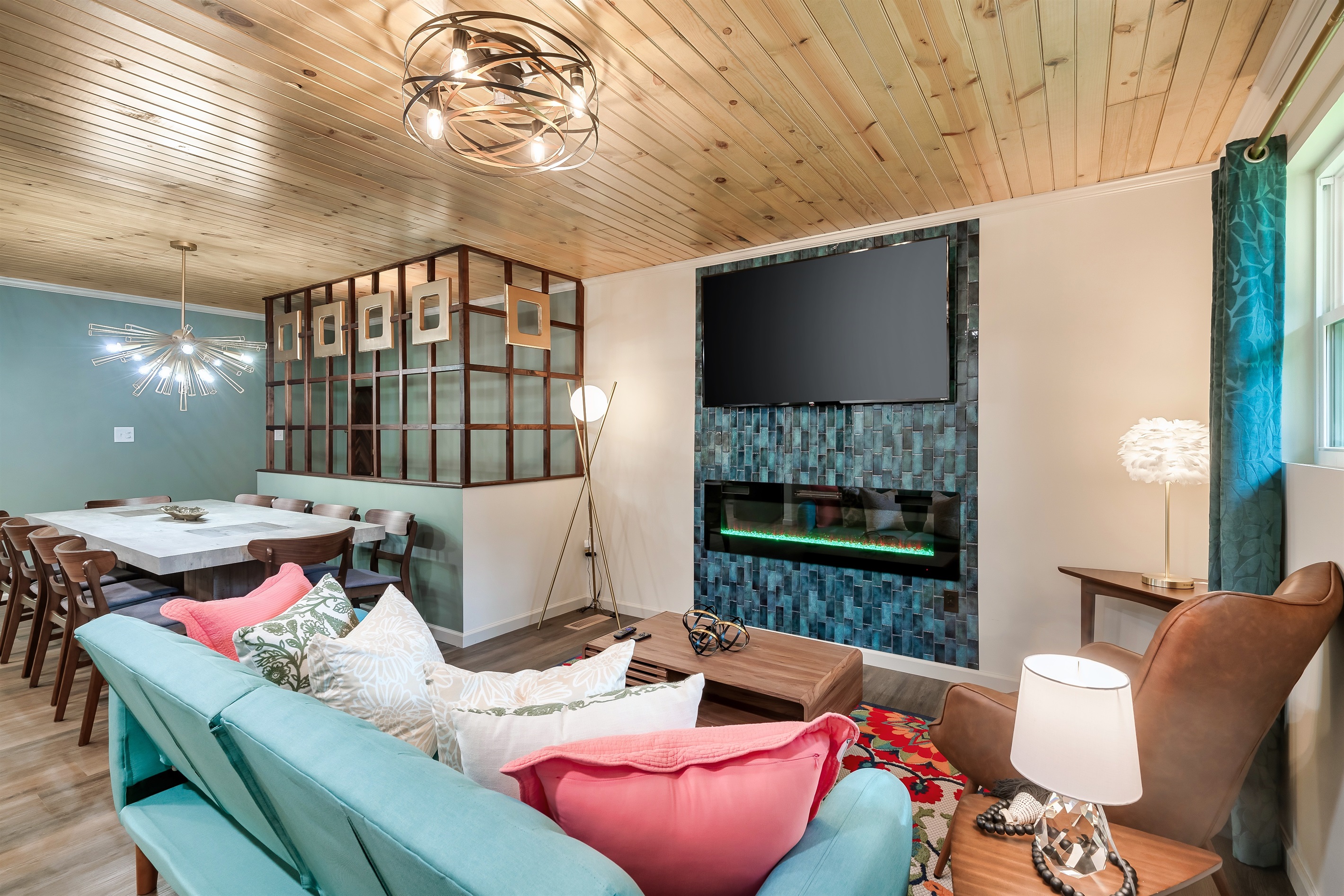 Style and function for your group. Relax by the electric fireplace while others socialize at the large dining table nearby.