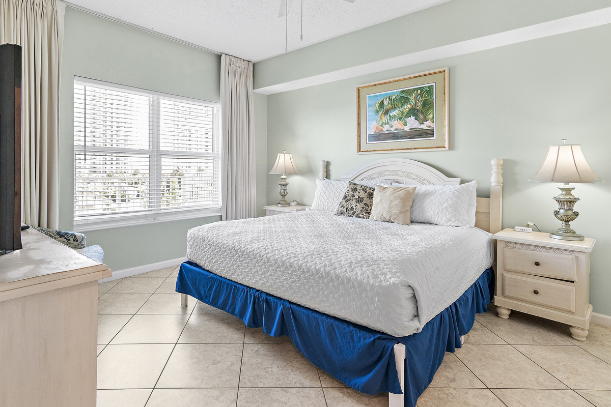 primary bedroom which features a King Bed, new furniture, Smart TV, large closet, and private bathroom with dual vanity