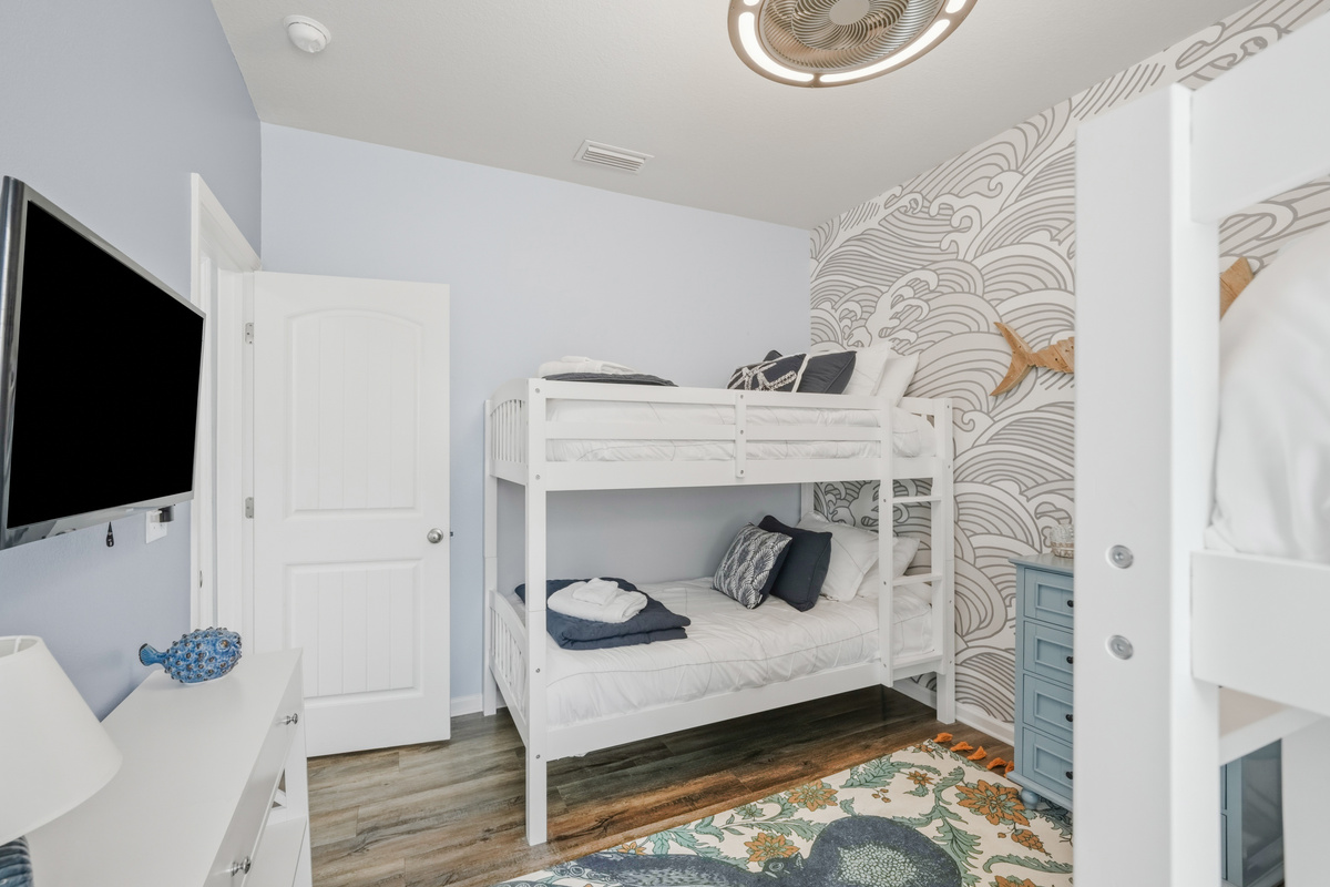 Bedroom 2: Twin bunk room offers plenty of sleeping space, Smart TV, and closet