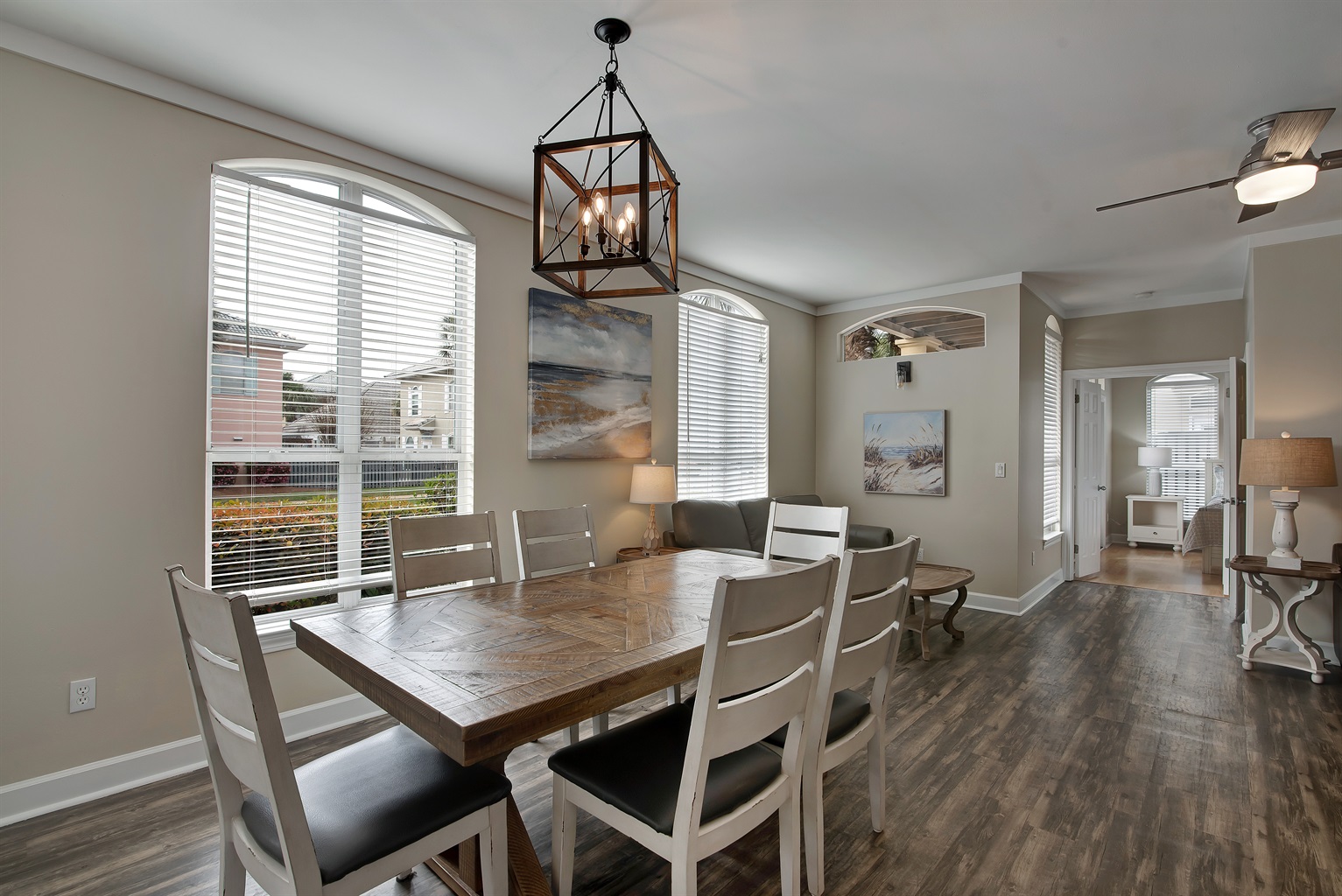 Formal dining area with farmhouse‑style table and chandelier
