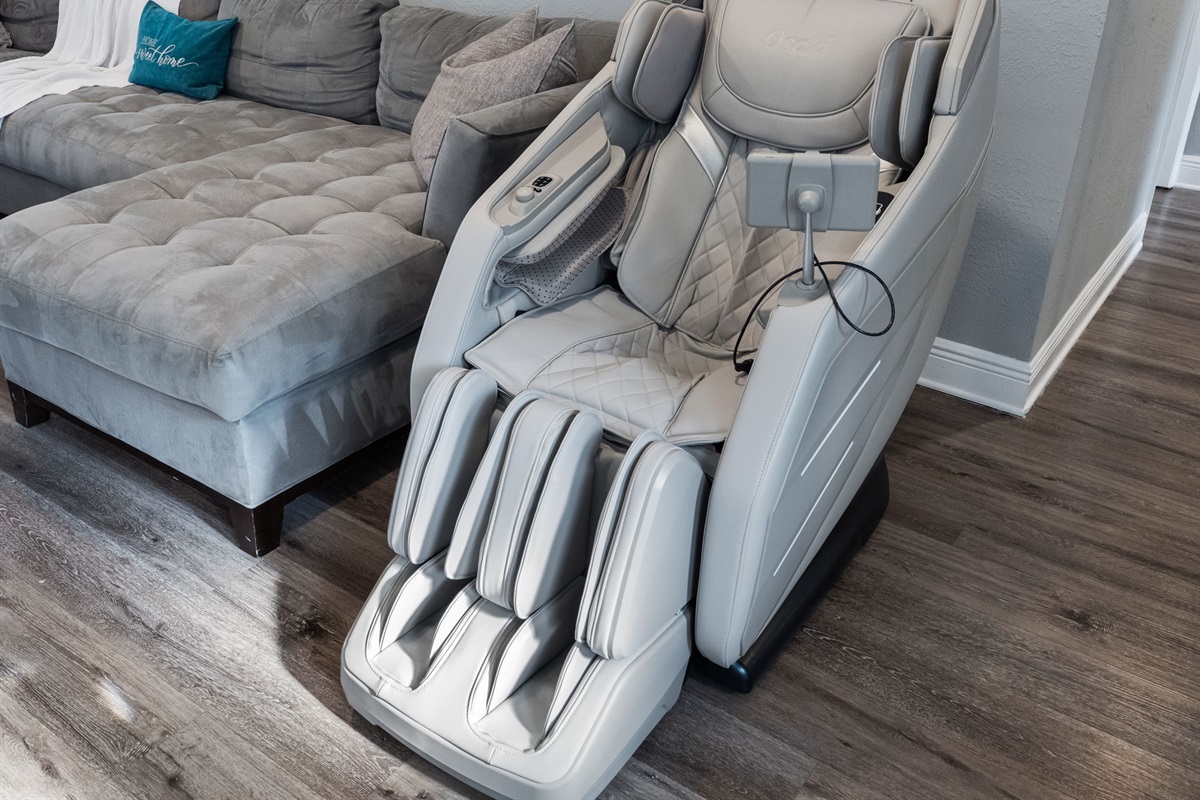 Sink into this state-of-the-art Osaki massage chair, designed to deliver full-body relief with customizable settings for your perfect unwind.