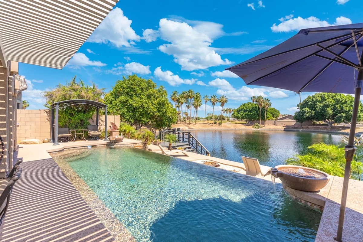 Lounge poolside under the pergola shade, stroll down to the lake dock, or just soak in the view — the backyard gives you plenty of ways to spend a slow, sunny afternoon.