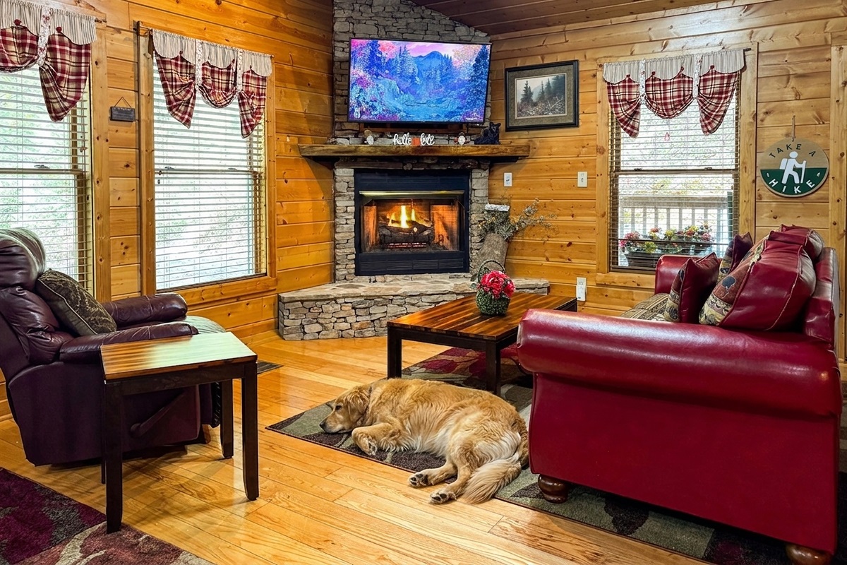 Cozy up by the stone fireplace, available Oct 1 to Mar 31. The perfect spot to relax and defrost after a day of hiking in the National Park.