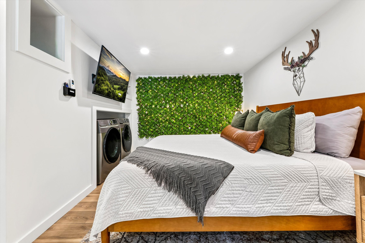 Master Bedroom with King Bed, 42-inch Smart TV, sound machine, blackout curtains and desk with computer monitor.   Full size washer/dryer with detergent provided.