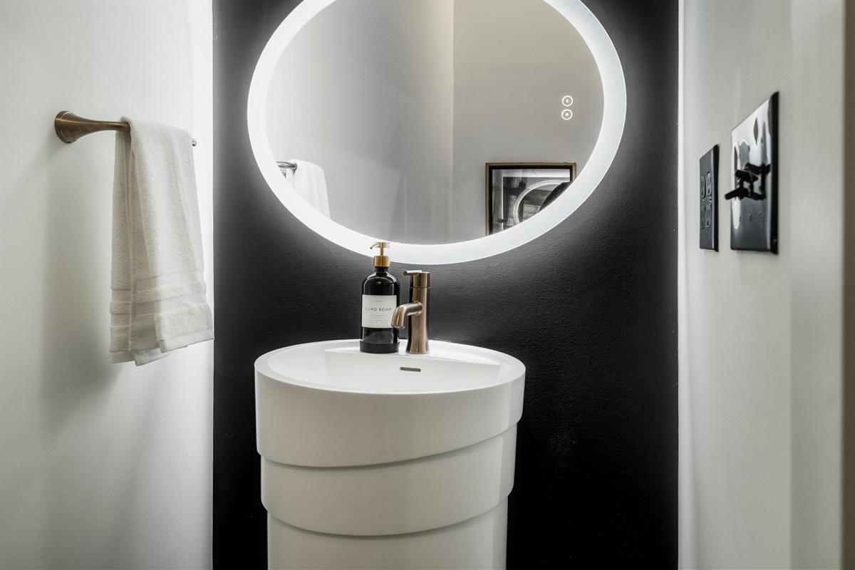 A stylish powder room conveniently located for guest access!