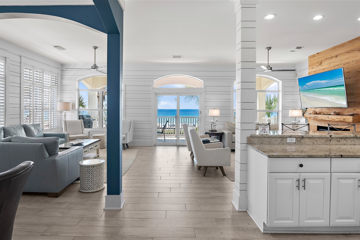 Open Living Space with comfortable seating, dining room, and kitchen - all overlooking the crystal-clear waters of the Emerald Coast!