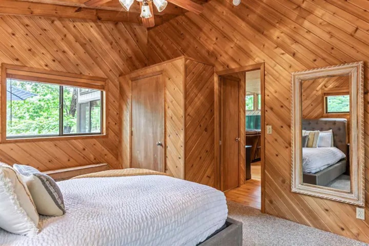 Main level bedroom with queen bed