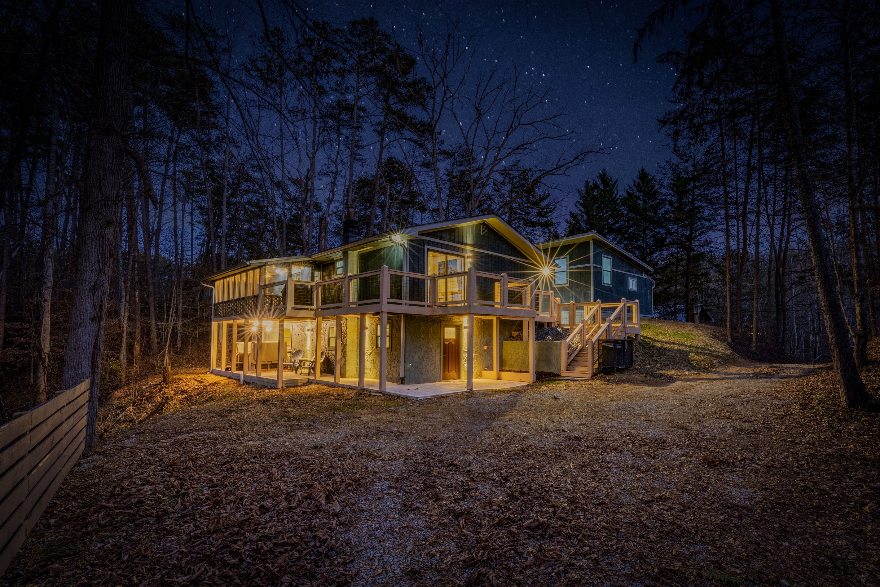 Mid Mod Mountain Bliss stands tall among the pines, offering a sophisticated and peaceful escape with ample outdoor space.