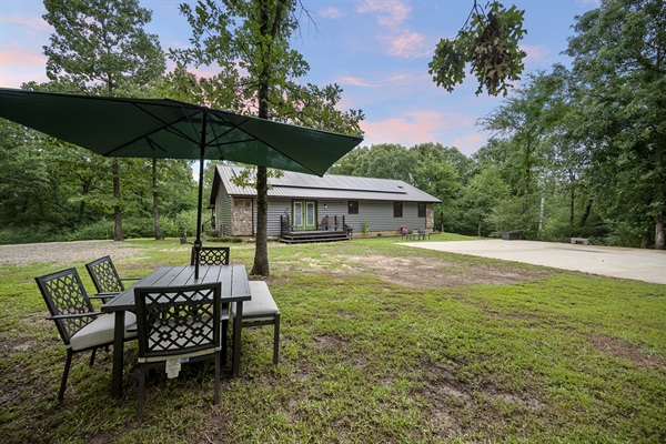 Enjoy the picnic table watching kids play in the backyard.