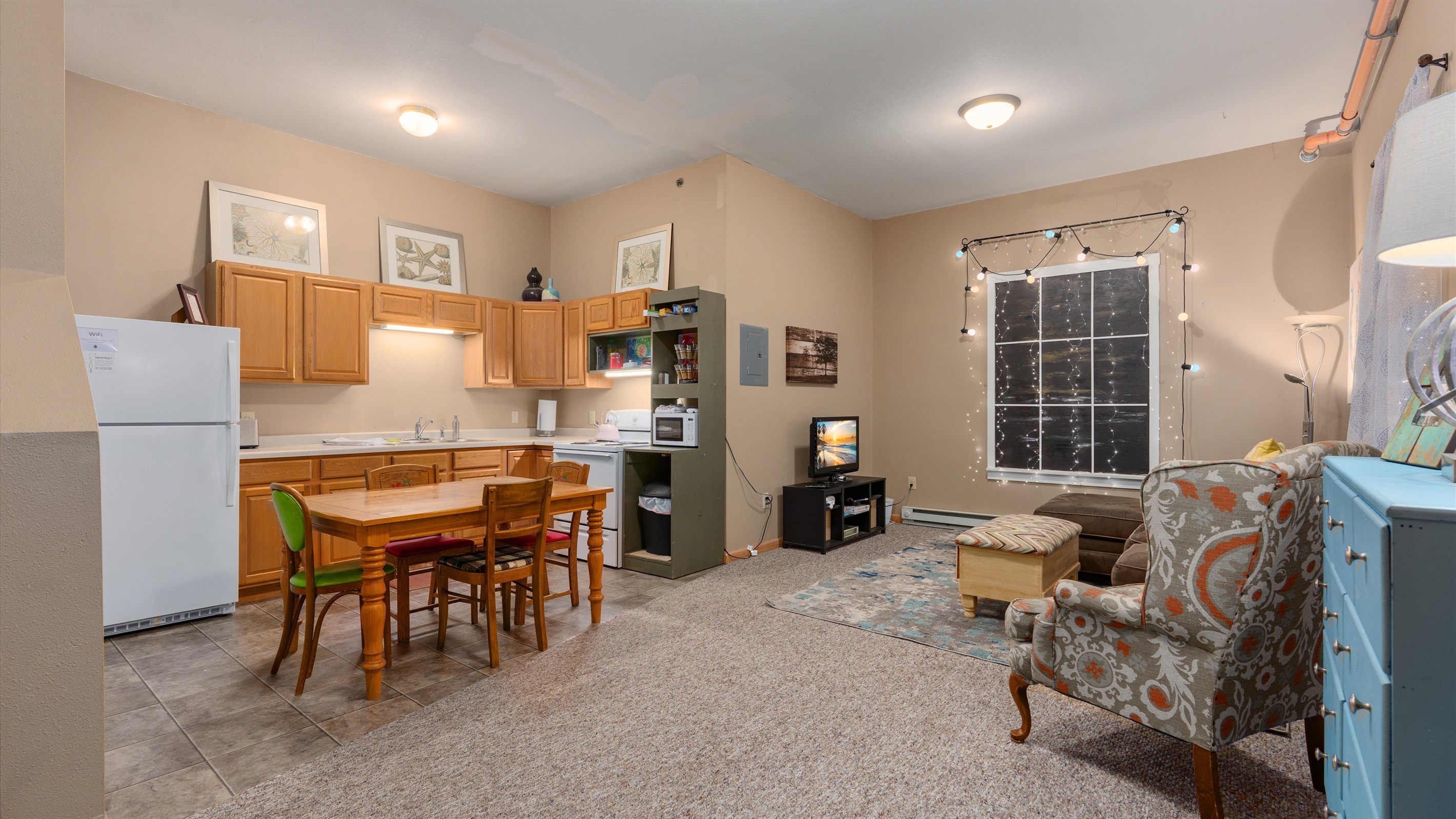 Both the living room and kitchen are interior; tucked into the middle of the building.