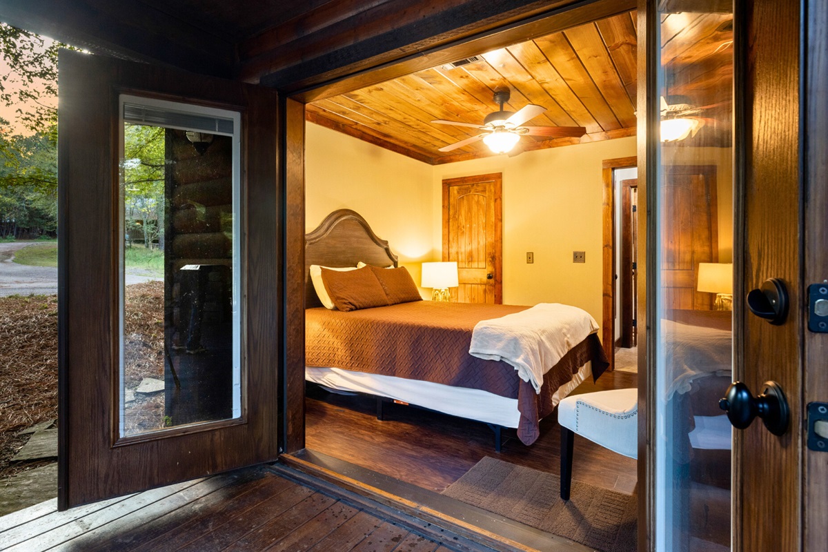 Rest easy in your queen retreat with rustic wood finishes and private deck access.