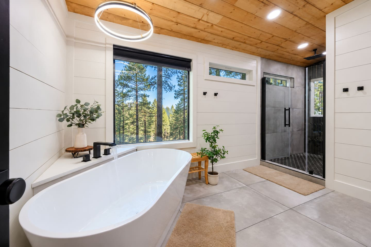 En-suite bathroom with a soaking tub, walk-in shower and double vanity.