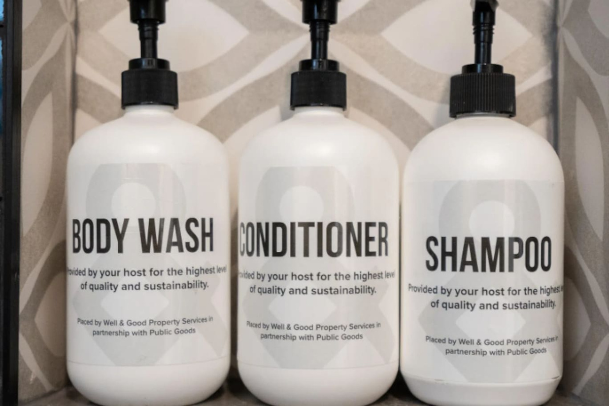 Full-size body wash, conditioner, and shampoo, stocked and ready — the small details that make a stay feel taken care of.