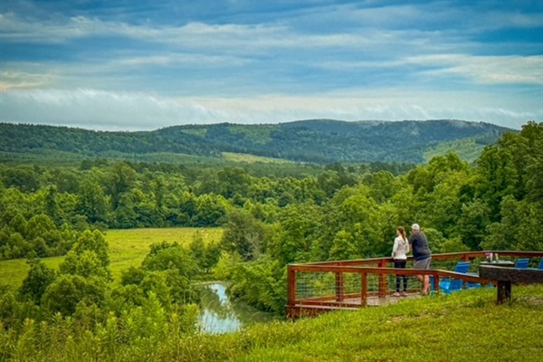 Enjoying the deck and river views together (guest photo - June 2025).