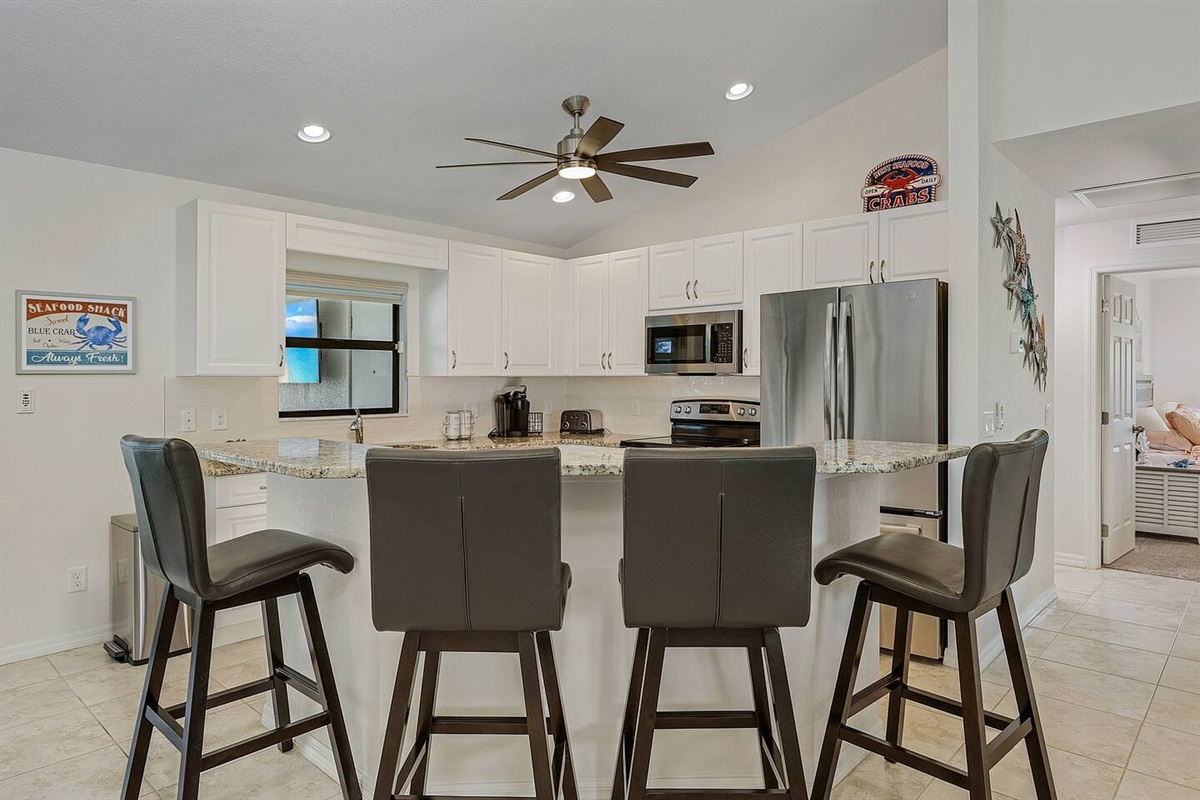 Kitchen island featuring seating for 4, perfect for gathering and casual dining!
