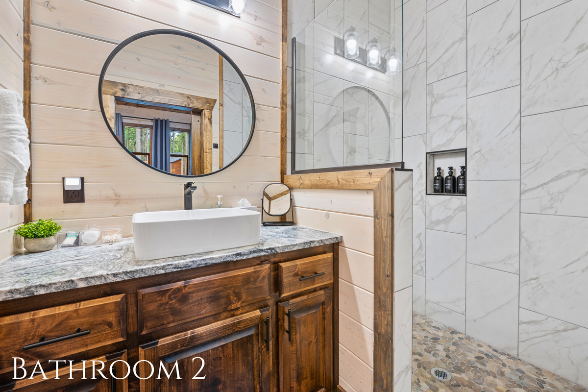 A modern and sleek bathroom with calming finishes, perfect for refreshing after a day of exploring.
